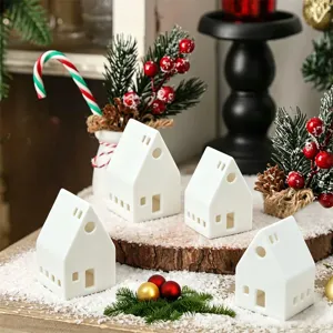Witte keramische kersthuisje theelicht kaarsenhouder set voor feestelijke decoratie.