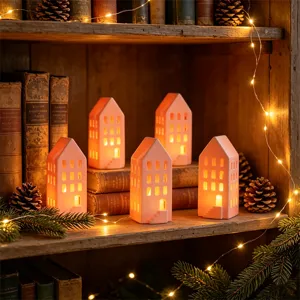 Kerst keramieken huis kaarshouder warm LED licht tafeldecoratie feestelijke sfeer