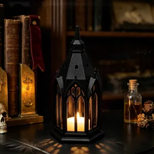 Gothic black castle candle lantern detail shot, glowing LED light for dark home decor aesthetic.