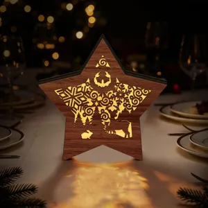 Wooden LED Christmas star light decor close-up, hollow carved deer and snowflake glowing nicely.