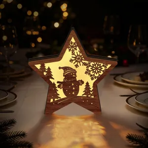 Close-up detail of wooden LED Christmas star ornament featuring hollow snowman pattern and warm glow.