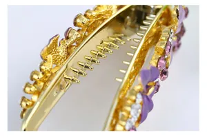 Detailed close-up view of gold alloy hair claw clip featuring elegant purple rhinestones.
