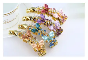 Detailed view of sparkling rhinestone butterfly banana hair clips in vibrant colors with alloy base.