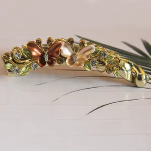 Elegant metal butterfly hair banana clip with sparkling rhinestones and colorful enamel details.