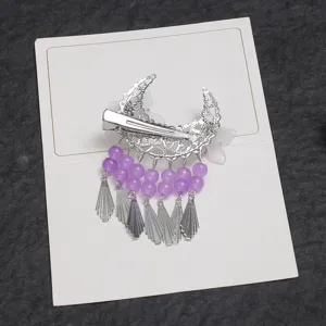 Chinese ancient style crescent moon hair clip with purple beaded tassels and white frosted flowers.