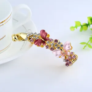 Elegant butterfly banana hair clip with colorful rhinestones, metal hair accessories for women.