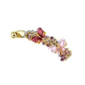 Gold rhinestone butterfly banana clip, elegant alloy hair accessory for women main view