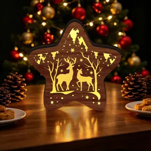 Wooden LED Christmas star night light, carved deer and tree glowing holiday tabletop decor.
