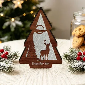 Close-up detail of the wooden LED Christmas tree ornament with deer and glitter background.