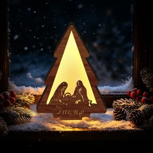 Detailed close-up of LED glowing wooden Christmas tree ornament with nativity scene cutout.
