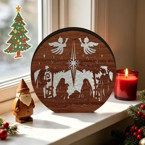 Close-up detail of a wooden glowing Christmas nativity scene decoration on a cozy windowsill.