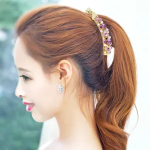 Korean style flower banana clip ponytail holder with rhinestones for women hair styling.