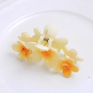 Large floral hair claw clip with a cute gradient frangipani design for women daily hair styling.