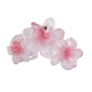 Large pink plumeria hair claw clip, 3D floral design, anti-slip back hair accessory for women.