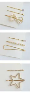 Detailed view of fashionable golden hair clips set featuring delicate pearls and sparkling rhinestones.