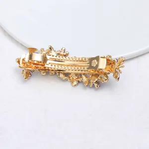Gold alloy floral hair clip detail view, elegant purple leaf spring barrette accessory.