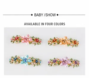 Detailed view of four colorful floral alloy spring hair clips with sparkling rhinestones.