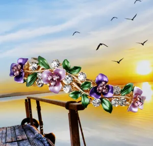 Detailed view of a Korean alloy floral hair clip with purple flowers and crystal rhinestones.