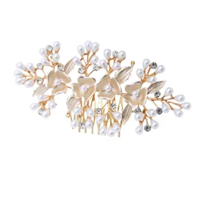 Elegant gold bridal hair comb with pearls and rhinestones, perfect for wedding updo styles.