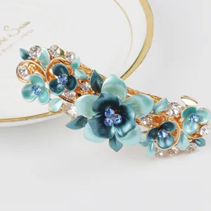 Blue enamel flower hair clip detail, elegant alloy rhinestone spring hair accessory for women.