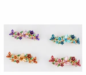 Detailed view of four colorful enamel flower hair clips, elegant alloy spring hair accessories.