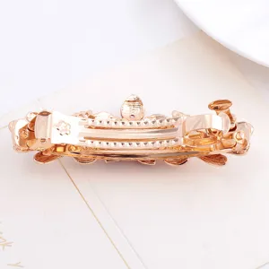Elegant gold alloy spring hair clip for women, perfect for half-up hairstyles and ponytails.