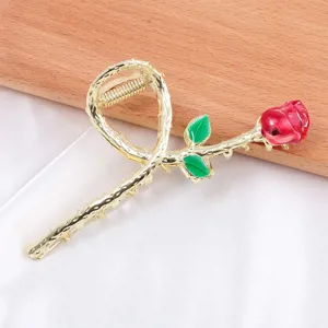 Gold metal rose hair claw clip for women, elegant floral design shark clip for stylish daily hairstyles.