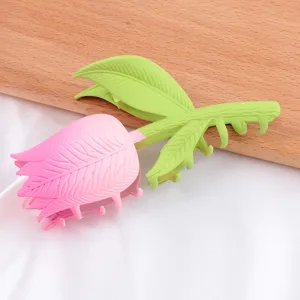 Cute tulip hair claw clip in pink and green, stylish shark clip for women daily hair styling.
