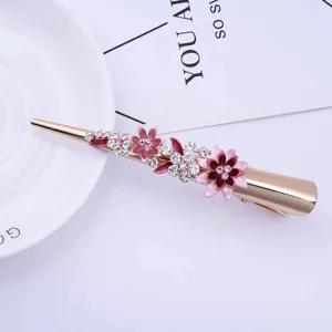 Gold alloy hair clip with pink enamel flowers and sparkly rhinestones for elegant hairstyles.