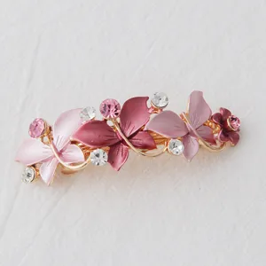 Korean style alloy butterfly and flower spring hair clip for women, elegant rhinestone design.