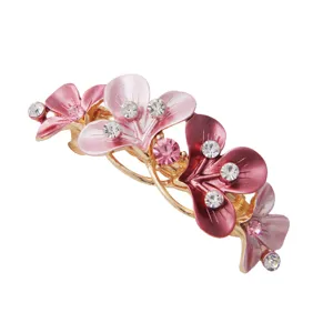 Elegant alloy floral hair clip for women, featuring sparkling rhinestones and pink enamel petals.