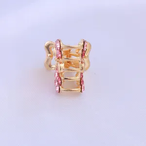 Mini metal hair claw clip with pink rhinestones, stylish and compact for sweet daily hairstyles.