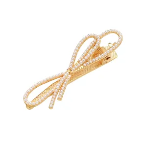 Goldener Perlen Schleife Haarclip für Damen, elegante metallische Seitenklammer Frisur.