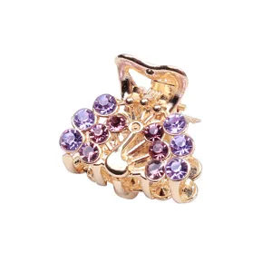 Mini gold metal hair claw clip with sparkling purple rhinestones for styling bangs and hair.