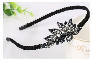 Close-up detail of the vintage blue rhinestone floral headband, elegant retro design texture.