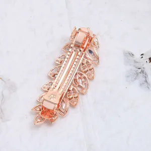 Elegante molletta a molla per capelli in lega oro rosa con design a foglia e strass luminosi.
