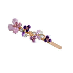 Chic enamel flower hair clip with rhinestones, elegant gold-plated side bobby pin for women.