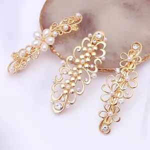Gold alloy hair clips with pearls and rhinestones, elegant floral design for women.