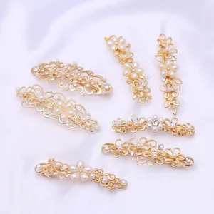 Elegant gold floral pearl hair clips for women, stylish alloy spring barrettes headwear.