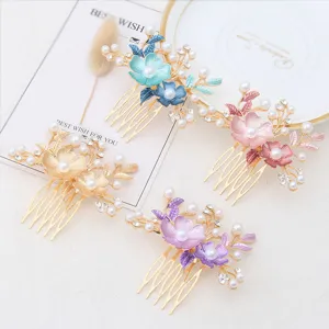 Elegant metal hair side combs featuring enamel flowers, faux pearls, and sparkling rhinestones.