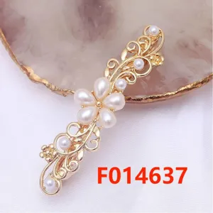 Metal alloy floral hair clip detail, elegant pearl decor, secure spring hairpin for stylish updos.