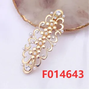 Gold alloy floral hair clip with rhinestones and pearls, elegant hair accessory detail view.