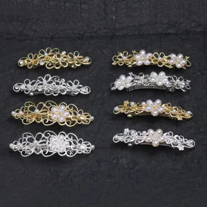 Elegant metal hair barrettes set featuring floral design with faux pearls and shiny diamonds.