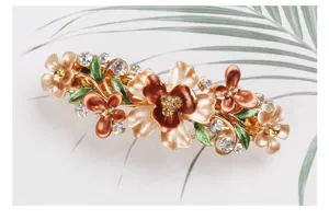 Detailed close-up of alloy enamel flower butterfly hair clip featuring sparkling crystal rhinestones.