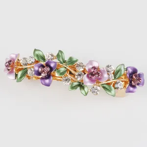 Detailed close-up of a charming alloy enamel flower rhinestone spring hair clip for women.