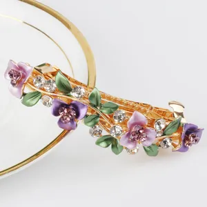 Elegant alloy rhinestone hair clip with purple enamel flowers and green leaves for women.