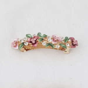 Exquisite metal enamel rhinestone flower hair clip detail, elegant spring hairpin for women.