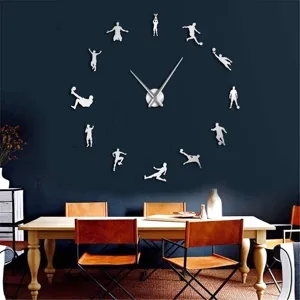 Detailed view of the 3D acrylic mirror wall clock with football player silhouettes on dark wall.