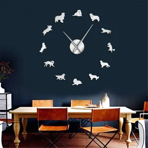 Close-up detail of the DIY dog silhouette wall clock on dark wall with metallic hands.