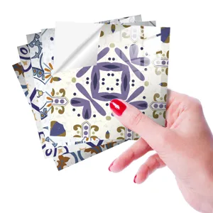 Close-up detail of retro tile stickers with glossy crystal surface and peeling backing paper.